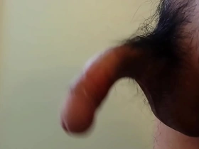Gay Asian man shows off his uncut penis