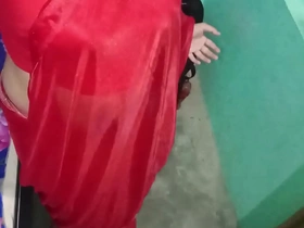 Gaurisissy, the Indian crossdresser in a red saree.
