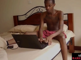 A black twink with an uncut cock masturbates with lotion.