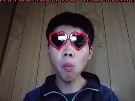 Young gay Japanese man masturbates on camera.